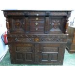 An antique joined oak press or livery cupboard. Elements early 18th century. 63' wide