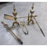 A pair of brass andirons and brass fire irons
