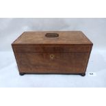 A George III mahogany tea caddy with banded inlay, the interior with two lidded tea boxes and an