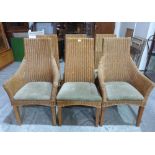 A set of six wicker dining chairs