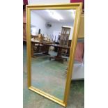 A gilt framed wall mirror. 53' high