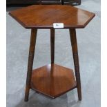 An early 20th century hexagonal two tier occasional table on splayed ring turned legs. 20½' high