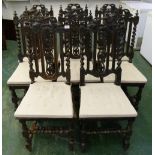 A set of seven continental oak carved barleytwist chairs in 17th century style and another similar