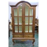 A French beechwood glazed cabinet, fitted with a pair of base drawers, raised on cabriole legs