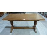 An oak refectory style dining table on bulbous supports. 61' long