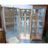 Two corner display cabinets and a wall display cabinet