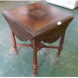 A Victorian marquetry and line inlaid rosewood dropleaf centre table on turned legs united by