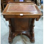 An early Victorian rosewood davenport, one side with a flight of four drawers enclosed by a