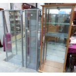 Three glazed display cabinets. (One with broken handle)