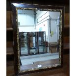 A parcel gilt wall mirror. 26' high