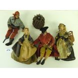 Four early 20th century seafarer of fisherfolk dolls with composition heads and wired limbs, 7'