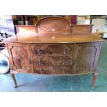 A 1920s mahogany bowfronted sideboard on cabriole legs. 60' wide