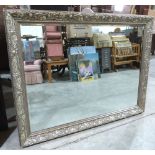 A wall mirror with silvered Art-Nouveau moulded frame and bevelled plate. 43' x 55'