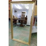 A gilt framed wall mirror with bevelled plate. 52' high
