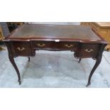 A late Victorian mahogany writing table in the French taste, with leather inlet top, on cabriole