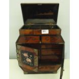 An oriental treen, ebonised and inlaid table cabinet. 14' high