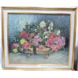 JOHN W. GOUGH. BRITISH 20TH CENTURY Flowers in a trug basket. Signed. Oil on board 25' x 30'