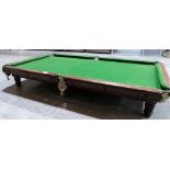 A 19th century mahogany snooker table with slate bed raised on six adjustable reeded feet. (one A.