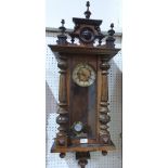 A walnut Vienna style wall clock with two train movement. 40' high