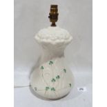 A Belleek table lamp decorated with shamrocks. 10½' high