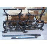 Coalbrookdale. A pair of Victorian cast iron bench ends, together with a pair of table ends