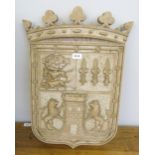 A resinous armorial plaque. 24' high