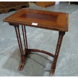 A nest of two mahogany and line inlaid spider leg occasional tables