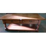 An oak low table with a pair of frieze drawers. 51' long
