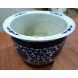 An Oriental style blue and white decorated jardiniere. 9' high