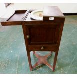 A George III mahogany gentleman's washstand, the divided hinged lid top enclosing a washbowl of