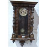 A walnut Vienna style wall clock with two train movement. 29' high