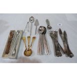 A collection of modernist flatware including three Georg Jensen silver gilt year spoons; Tapio