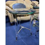 A MODERN GLASS CIRCULAR OCCASIONAL TABLE / A MODERN GLASS TOPPED OCCASIONAL TABLE