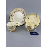 A TUSCAN 'PLANT' PATTERN PART TEA SERVICE AND ANOTHER TEA SERVICE