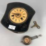 A 20TH CENTURY TIN WALL CLOCK