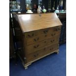 A 20TH CENTURY OAK WRITING BUREAU