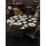 A MAHOGANY CIRCULAR DINING TABLE