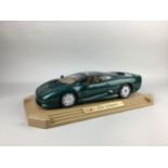 A MODEL OF A JAGUAR XJ220 ALONG WITH A DVD