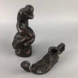 A BRONZE FIGURE OF A MERMAID AND A CANDLESTICK MODELLED AS A FOOT