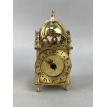 A REPRODUCTION LANTERN CLOCK AND A CARRIAGE CLOCK