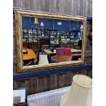 A DECORATIVE WALL MIRROR