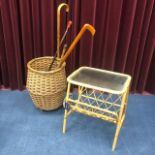 A WICKER SHOPPING BASKET, A BAMBOO SIDE TABLE AND WALKING STICKS