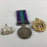 A MEDAL, BADGE AND BROOCH