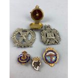 A GROUP OF MILITARY AND OTHER BADGES AND A REPRODUCTION COMPASS