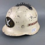 A FALCK TIN FIREMAN HELMET