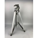 A METAL CAMERA TRIPOD STAND AND CAMERA