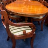 A REPRODUCTION YEW WOOD MAHOGANY DINING TABLE AND SIX CHAIRS