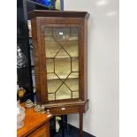 A 19TH CENTURY MAHOGANY HANGING CORNER CUPBOARD