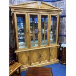 A MODERN MAPLE DISPLAY CABINET