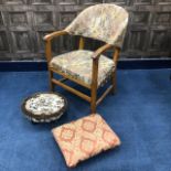 AN UPHOLSTERED ARMCHAIR, TWO FOOTSTOOLS AND A TWO TIER GLASS TROLLEY